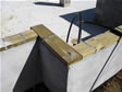 Sill plate and straps sit on top of concrete block ready for modular home installation