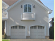 Two car integral garage has balcony and living space above in this Monmouth County, Monmouth Beach, NJ home