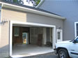 A single garage door is designed to fit this oversized, extra wide, attached garage