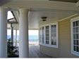 Large rounded porch columns make a stately look and are a focal point of this NJ shore modular home 
