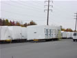 Sections of modular homes wrapped and ready for delivery to Monmouth County, NJ