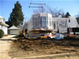 Oversized crane installing the first floor modular unit of a home in Monmouth County, Oceanport, NJ