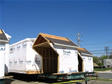 Modular transportation carrier ready to deliver roof dormer section to a job site in NJ