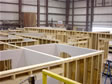 Assembly line showing modular homes being built by specifications in the factory