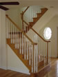 Wood stairs can be stained and finished to match the surrounding hardwood oak flooring