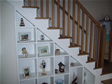 Unique built-in staircase shelves adds character and provides space for knick-knacks, etc. 