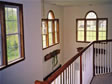 Half round windows with stain package give an elegant look to any modular home entry foyer