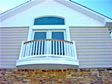 Create a more stately and elegant look by adding a transom widow above a french door on this balcony