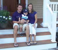 The family on the portch of their new home.