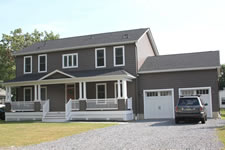 The front porch was a perfect look for this Jersey Shore home, on a large property. The full basement and 2 car garage was essential for this family when planning their dream home.